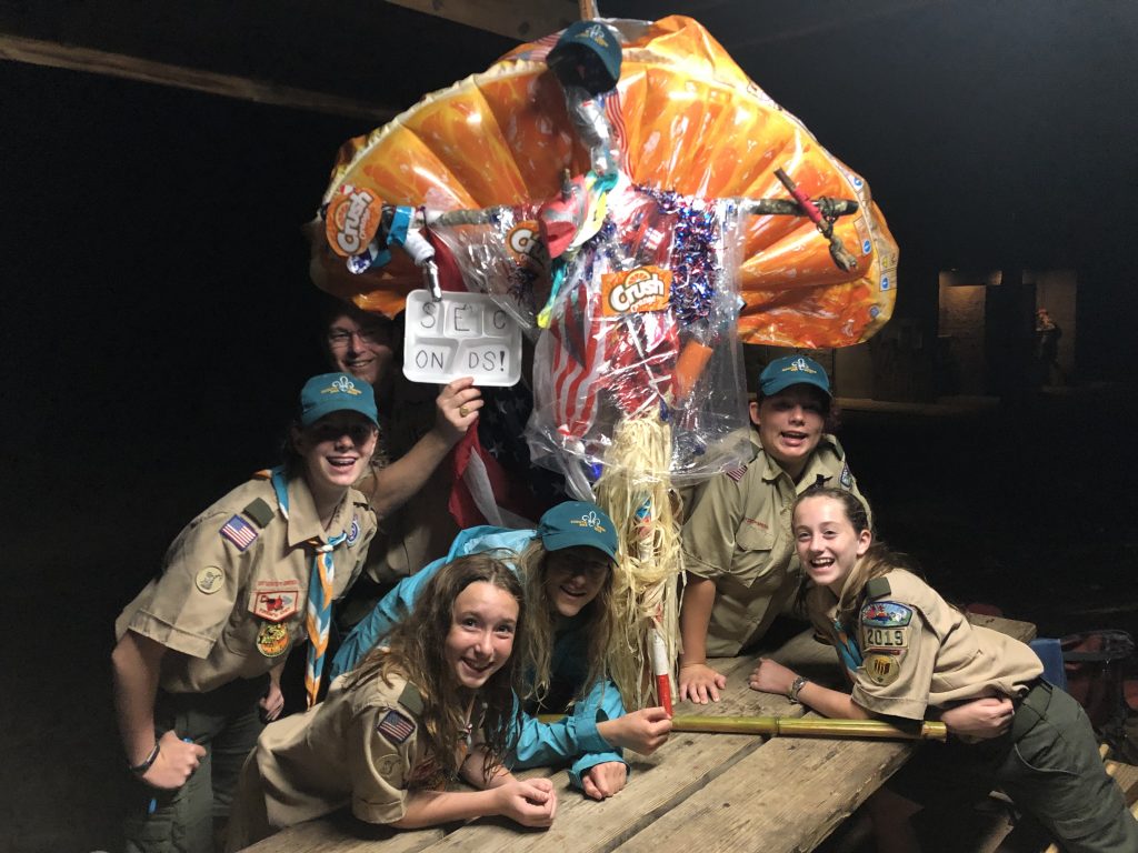 Scouts around Camp Durant Spirit stick.